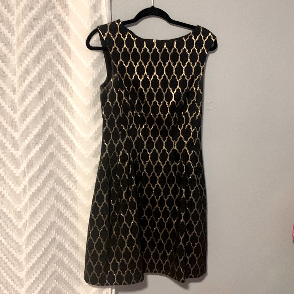 Vince Camuto size 6 lined black and gold dress. Lightly worn.